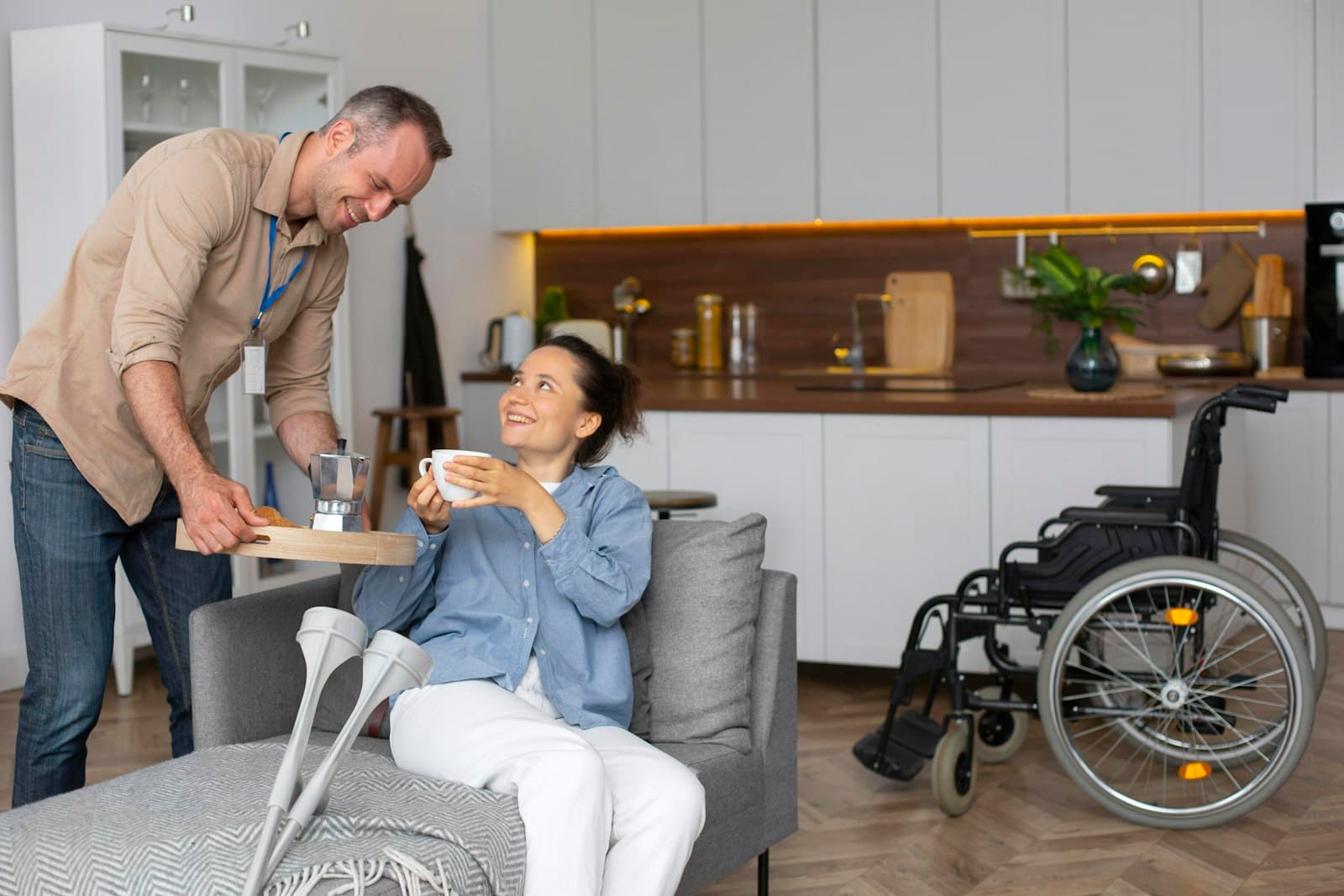 A man and a woman talking in a living room
